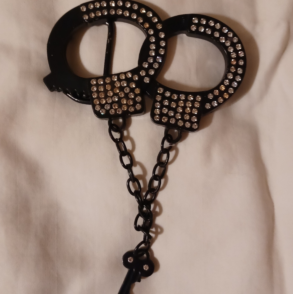 Black metal handcuff belt buckle with bling